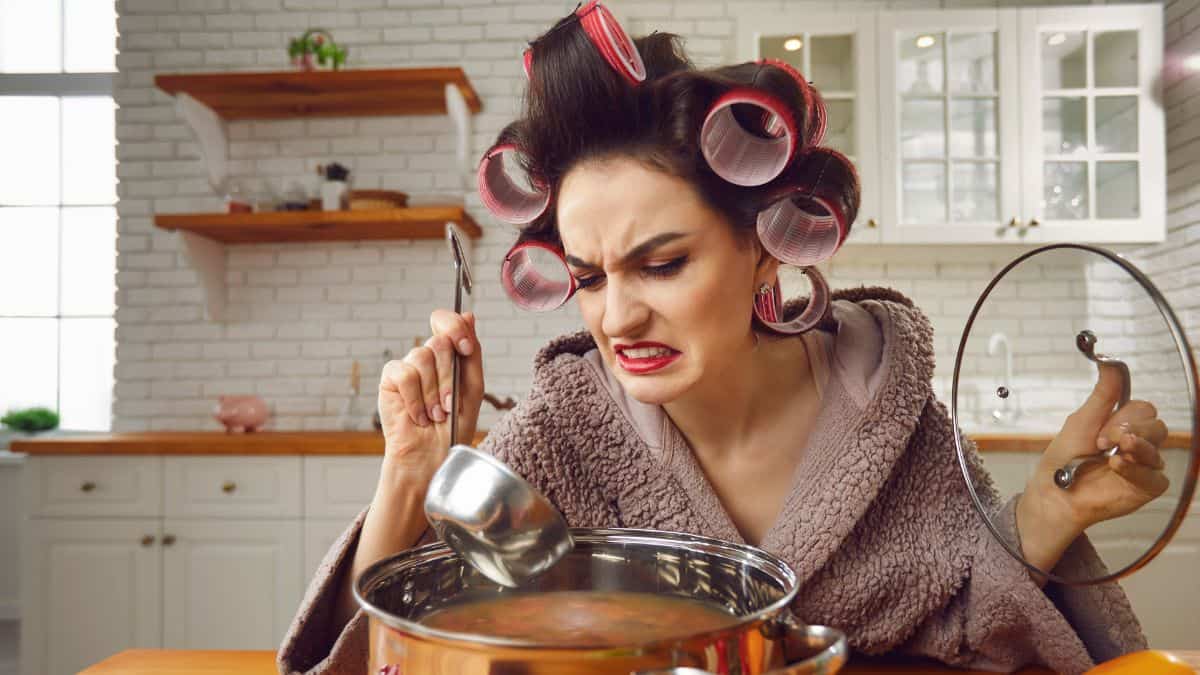 frustrated woman making soup