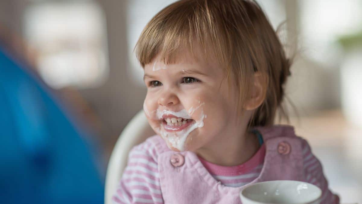 messy girl with yogurt