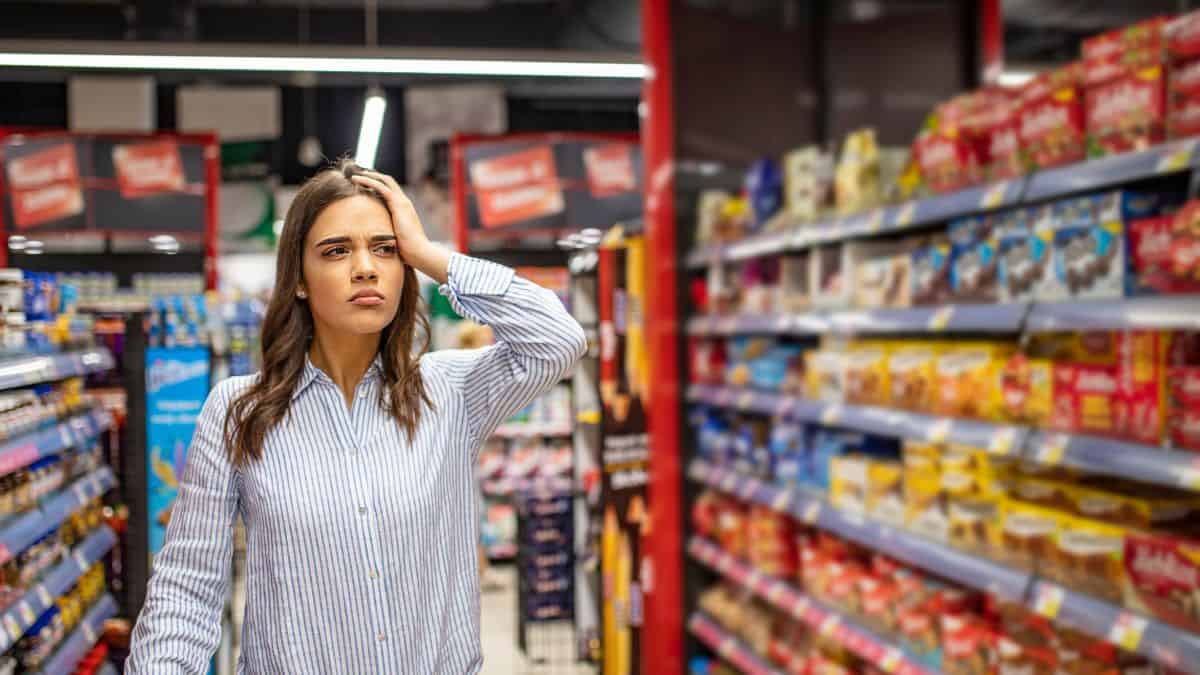 woman looking confused in grocery store