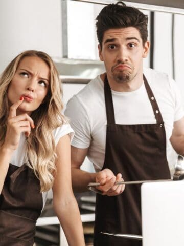 confused couple in kitchen