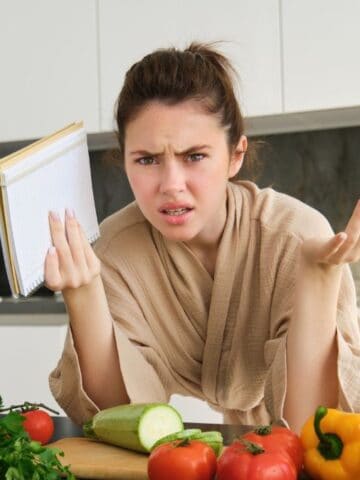 confused woman in kitchen
