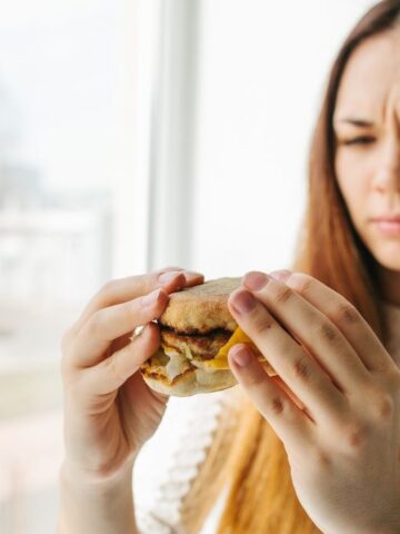 confused woman looking at food