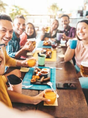 happy friends eating together