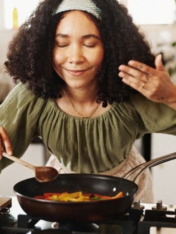 happy woman smelling food