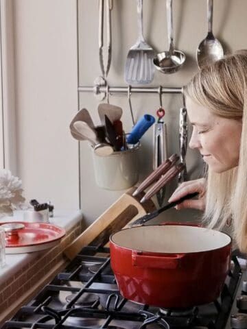 happy woman smelling stew
