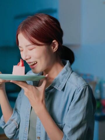 happy woman with cake at night