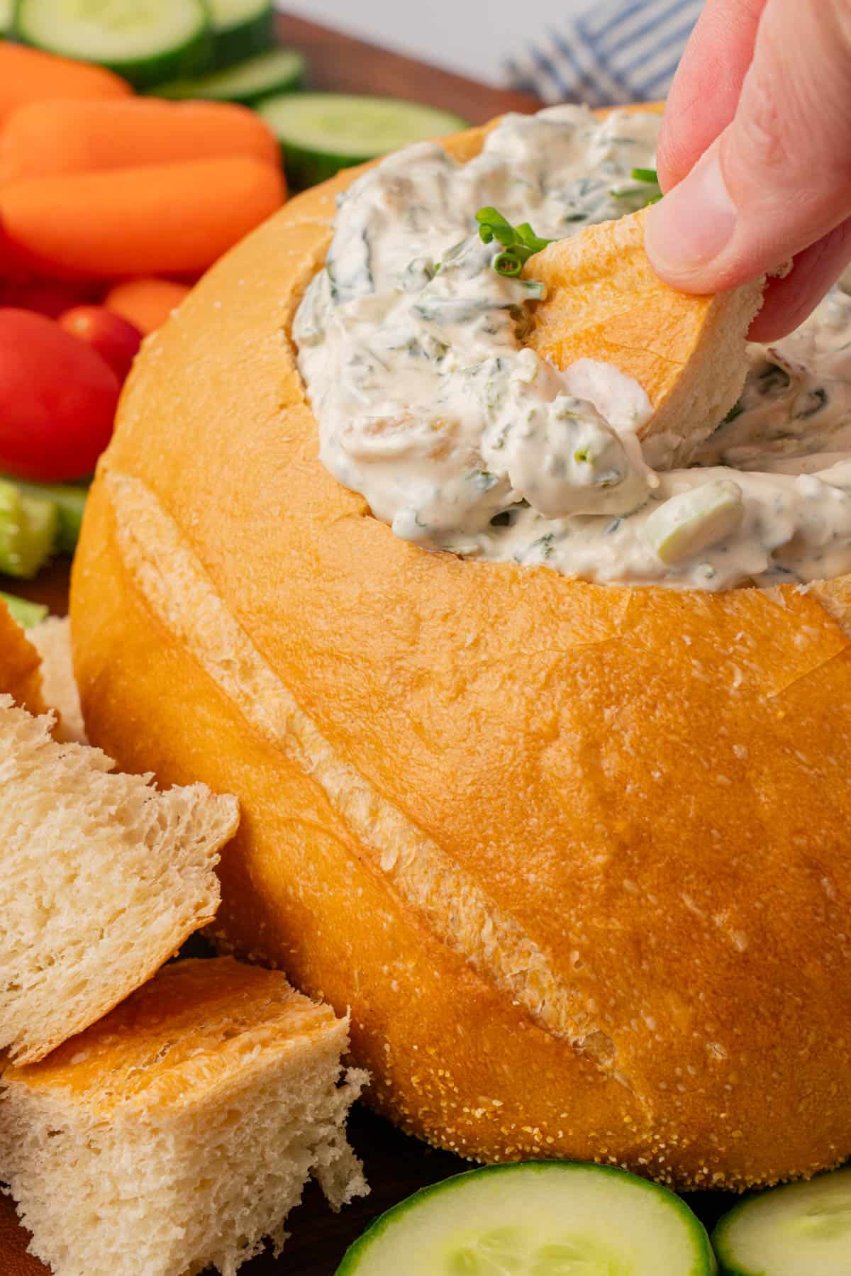 a piece of bread dipped in the Knorr's Spinach Dip