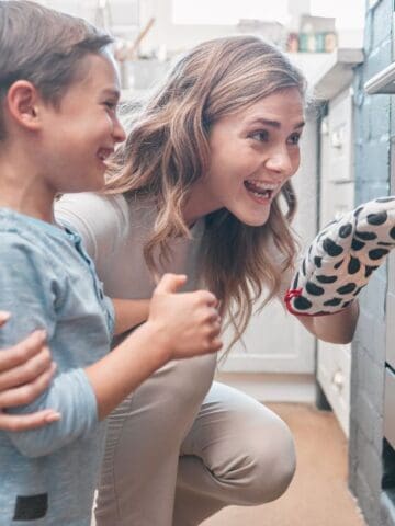 mom and son looking in oven