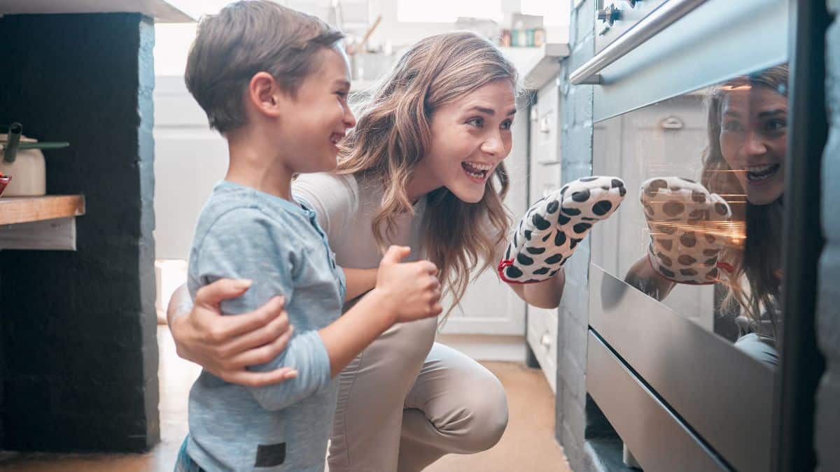 mom and son looking in oven