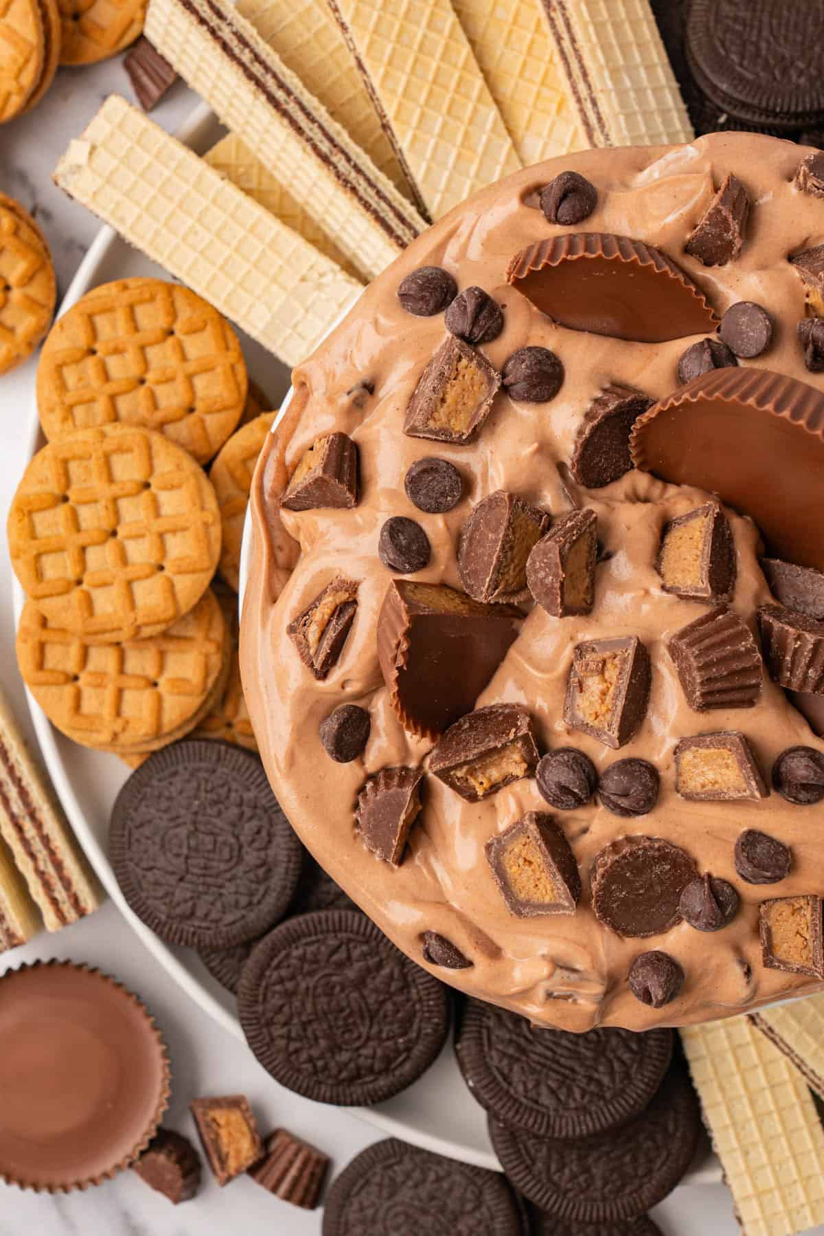 Overhead picture of the peanut butter fluff salad alongside some wafers, cookies for dipping