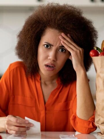 upset woman with grocery bill