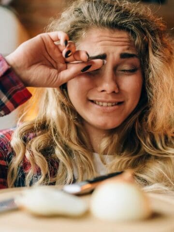 woman crying from onions