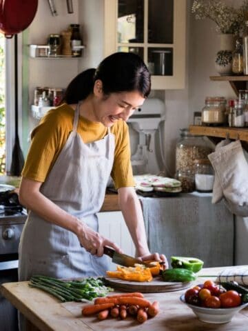 woman cutting veggies
