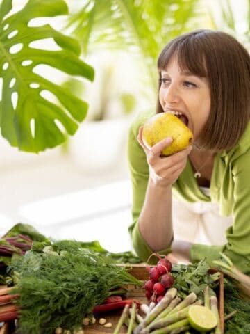 woman eating a pear