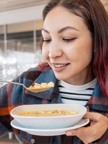 woman eating soup