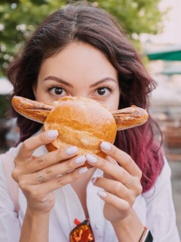 woman holding sandwich