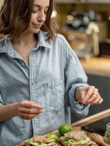 woman making avocado toast