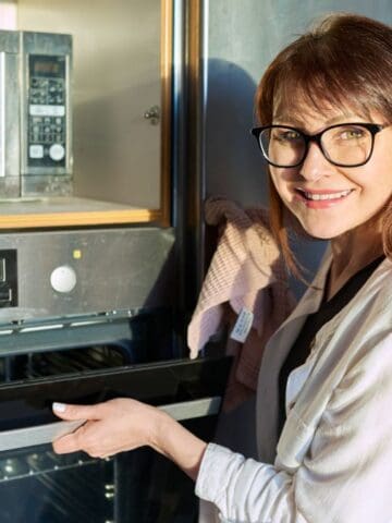 woman smiling with oven