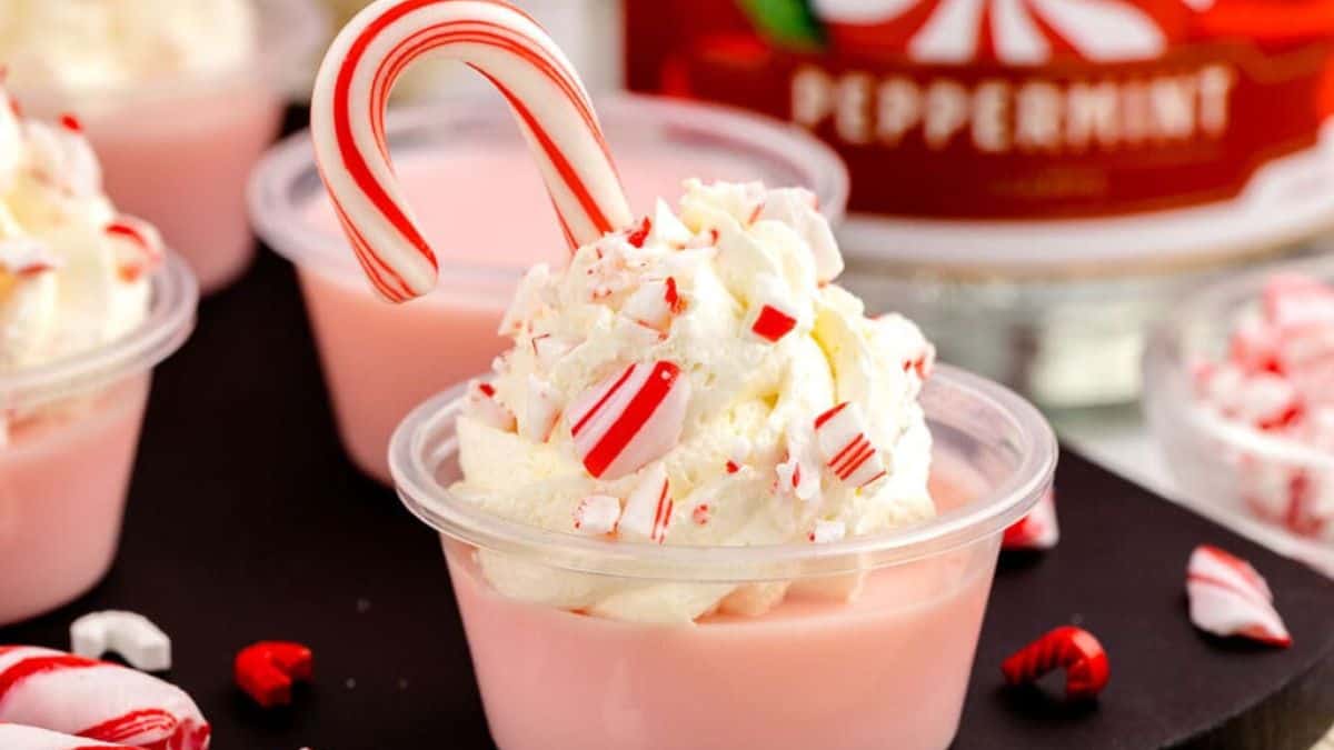A close-up shot of Candy Cane Jello Shots with available few other shots available in the background.