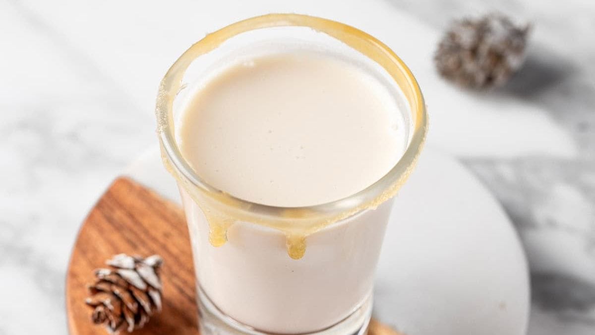 A single shot glass of Salted Nut Roll Shot. 