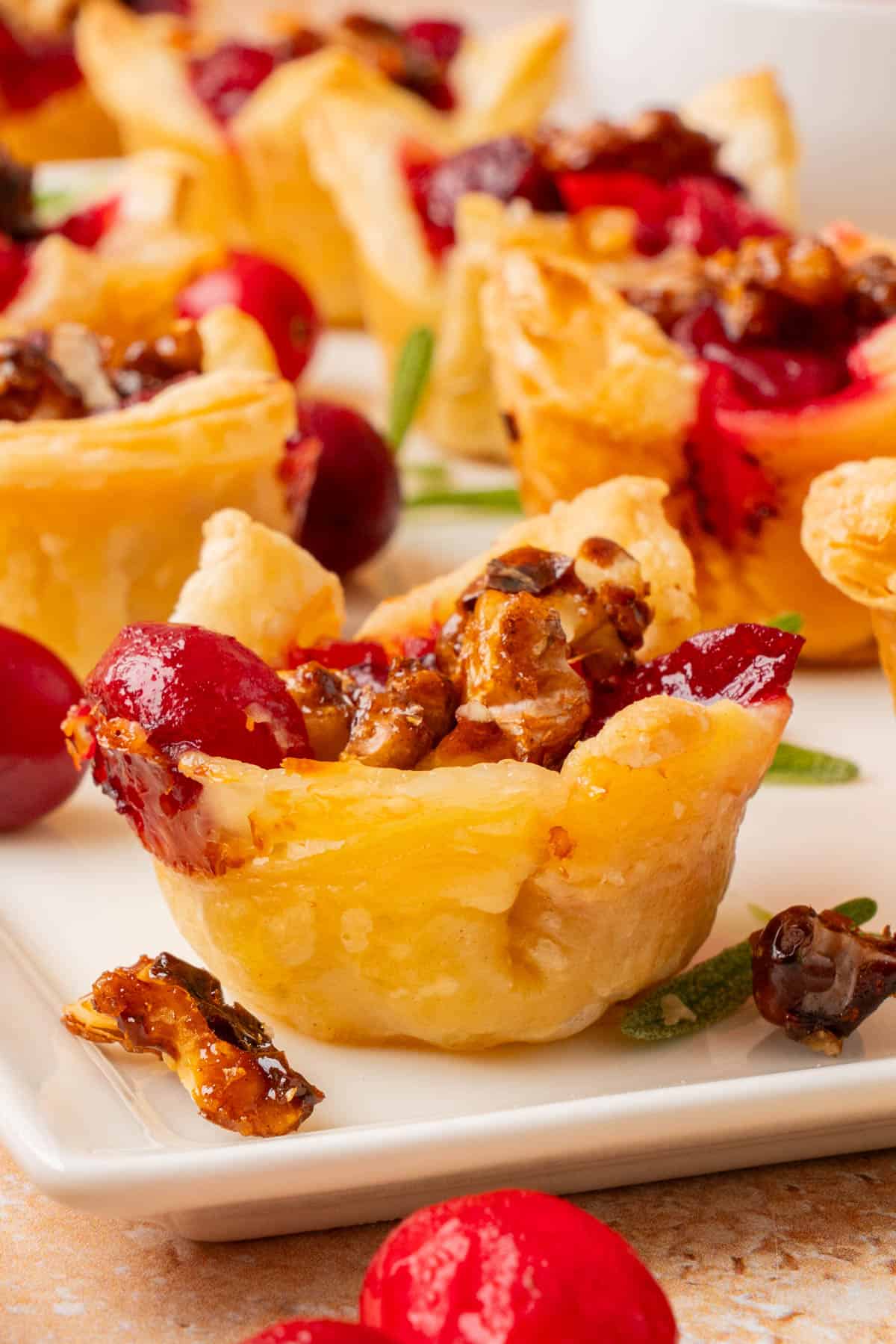 Close-up, side angle shot of a cranberry brie bite.
