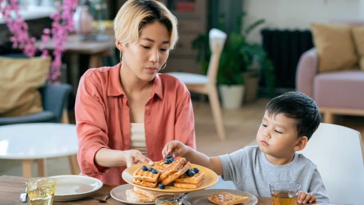 mom and son eating waffles