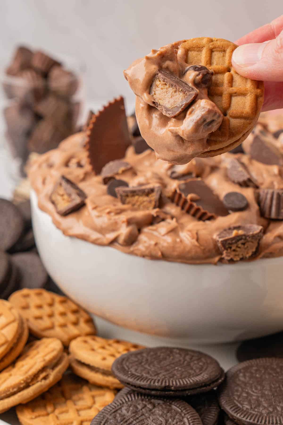Close-up image of a cookie dipped into the fluff, ready for eating