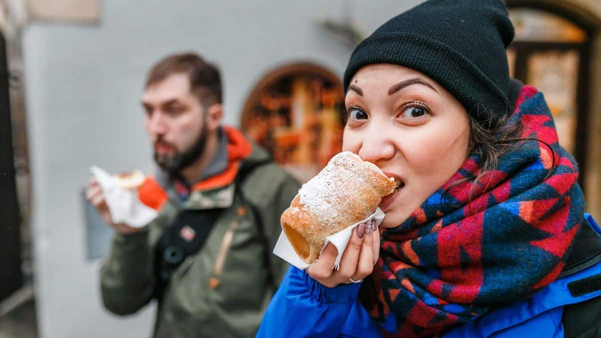 woman eating a cinnamon roll
