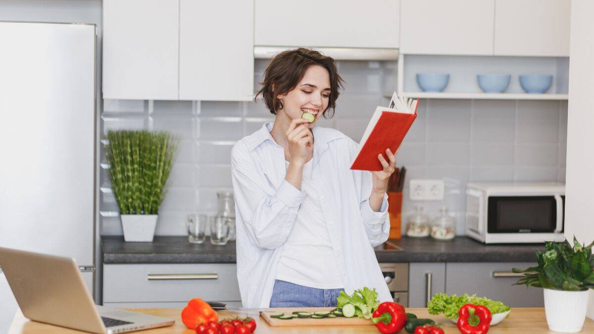 woman reading a cookbook