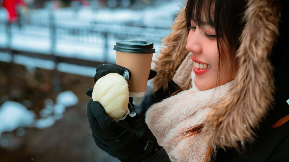 woman with coffee and cookie
