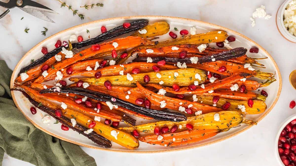 A serving platter with maple roasted carrots.