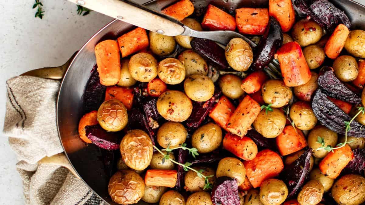 A serving plate filled with roasted root veggies.