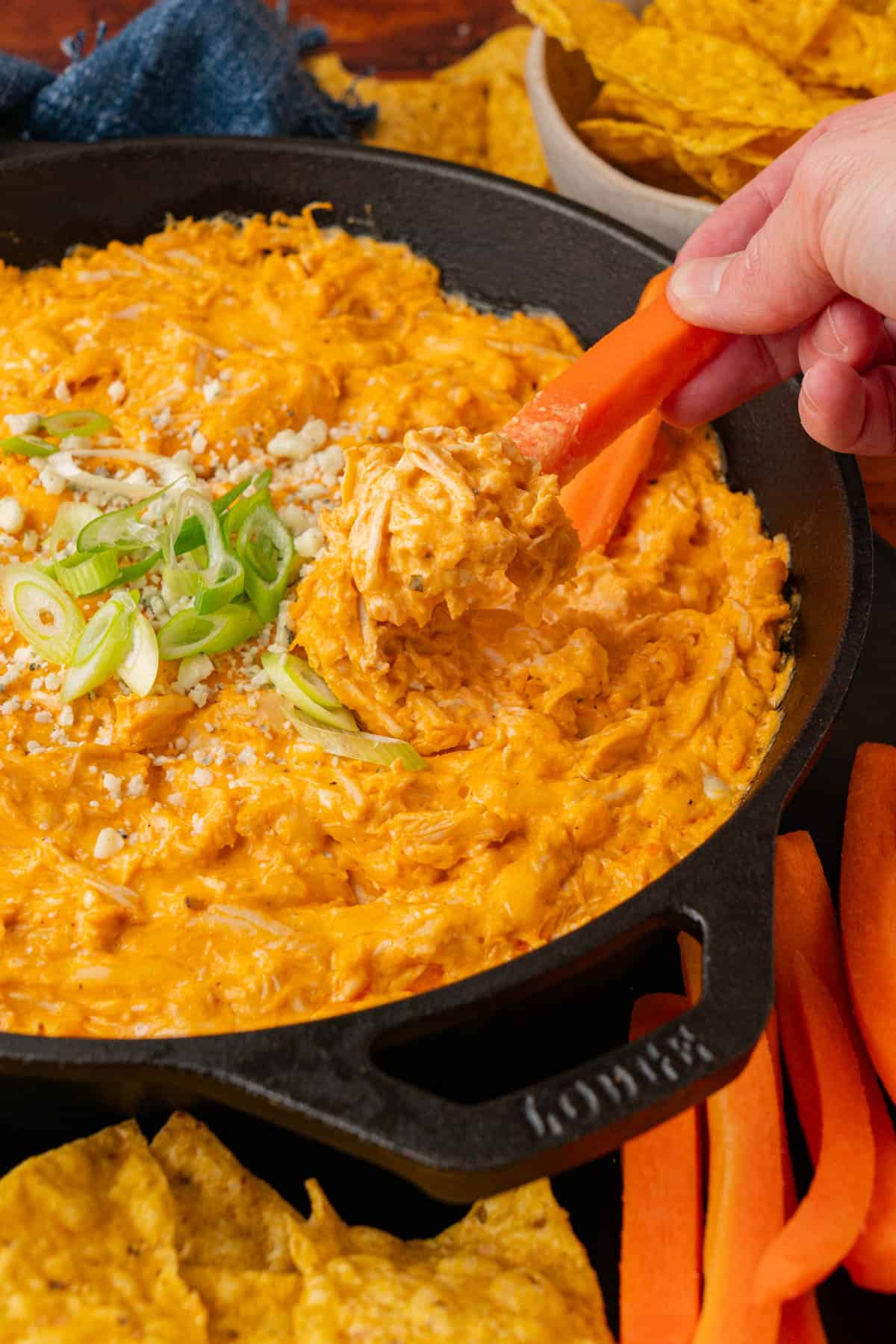 carrot stick dipped in the buffalo chicken dip.