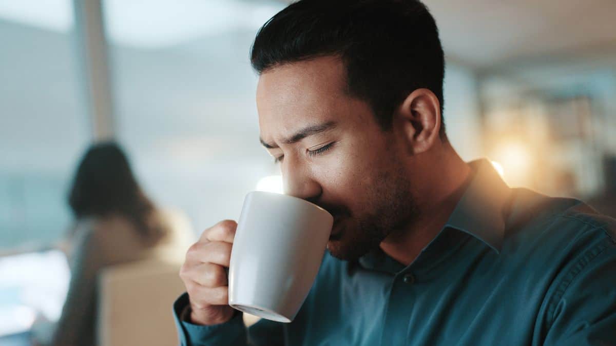 tired man drinking coffee