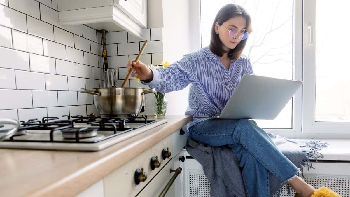 woman cooking on computer