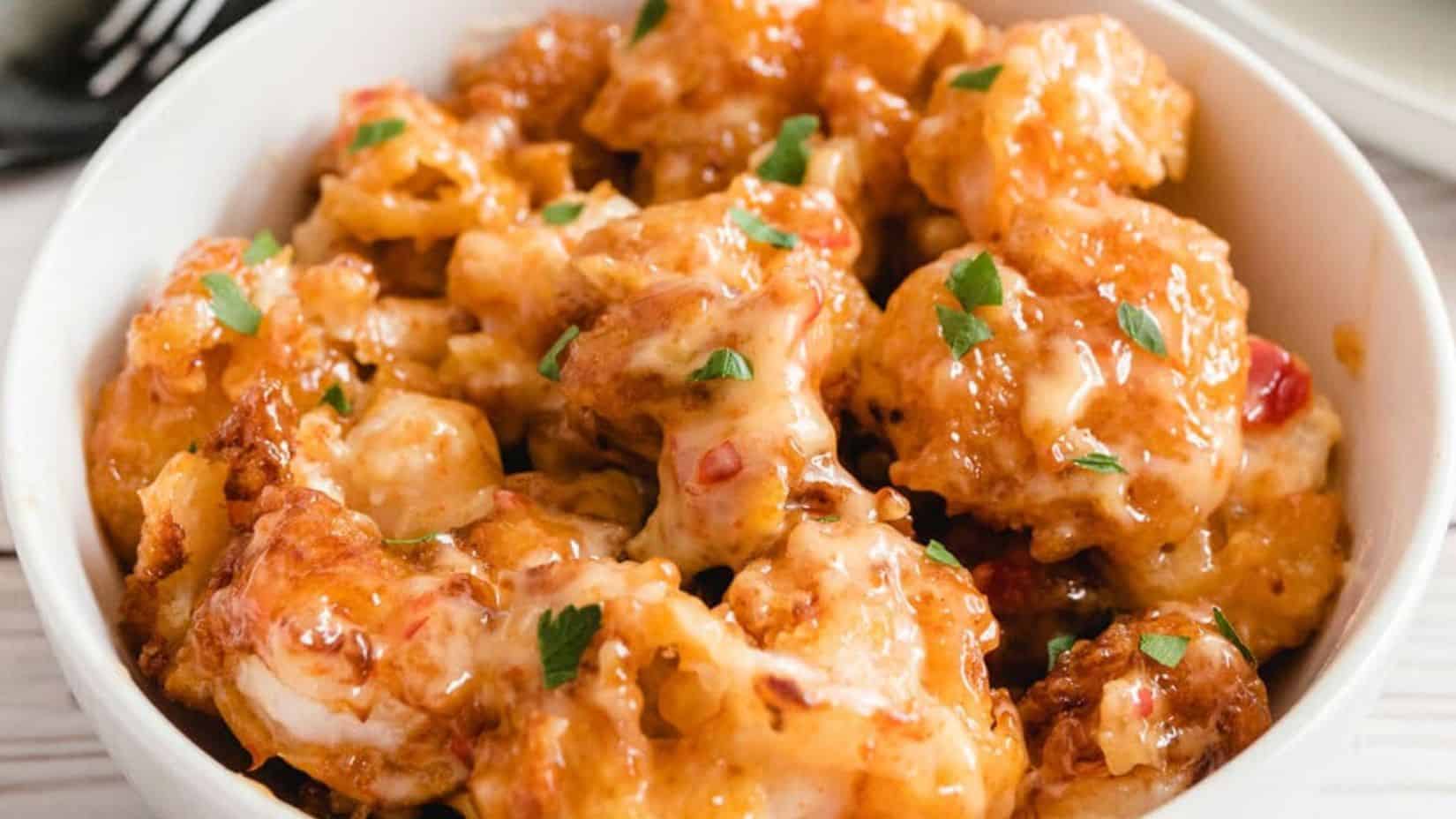 White bowl filled with bang bang shrimp. 