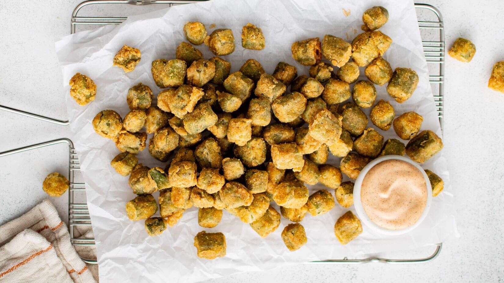 Top shot of Buttermilk Fried Okra with dip on the side. 