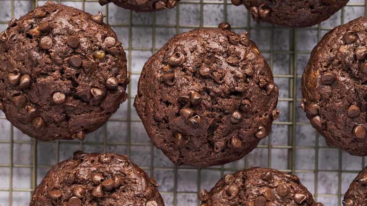 A close-up shot of a couple of pieces of Chocolate Muffins resting on a wire rack.