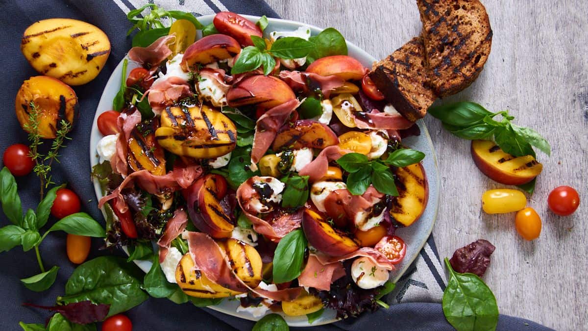 A plate with Grilled Peach Mozzarella Salad