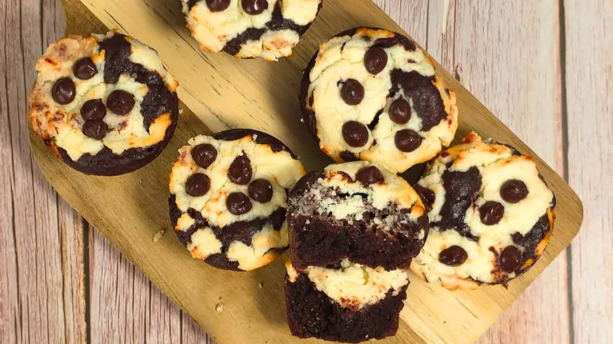 Top shot of 6 pieces of Keto Cottage Cheese Brookie Muffins set on a wooden