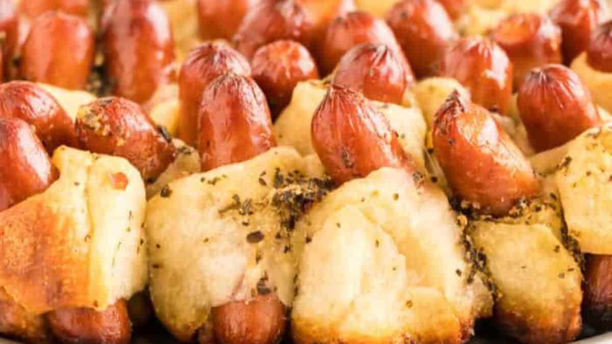 A close-up shot of  a couple of pigs in a blanket.