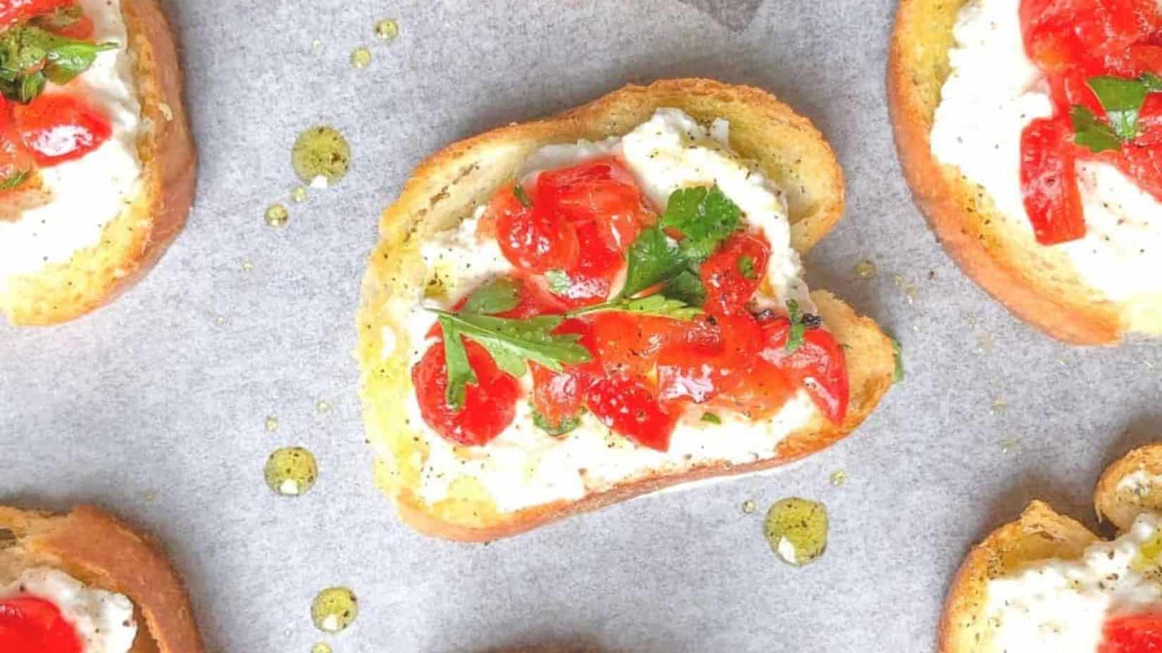 A top shot of a few pieces of ricotta cheese crostini.