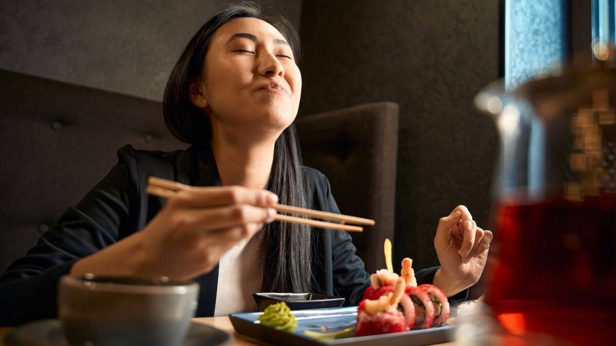 happy woman smelling food