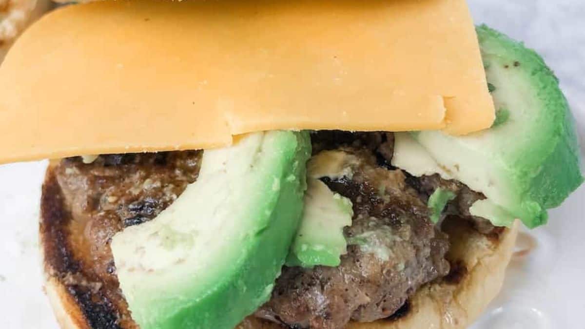 Close-up shot of Baja Burgers with avocado slices.