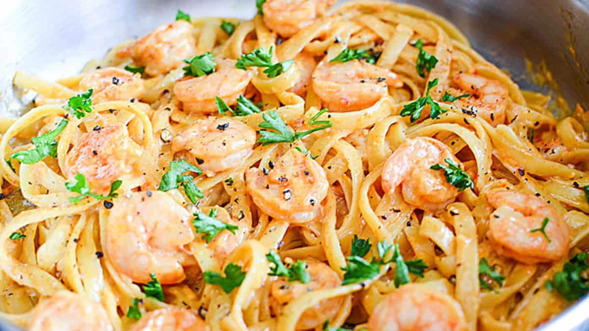 Bang bang shrimp pasta with creamy spicy sauce and shrimp over noodles.