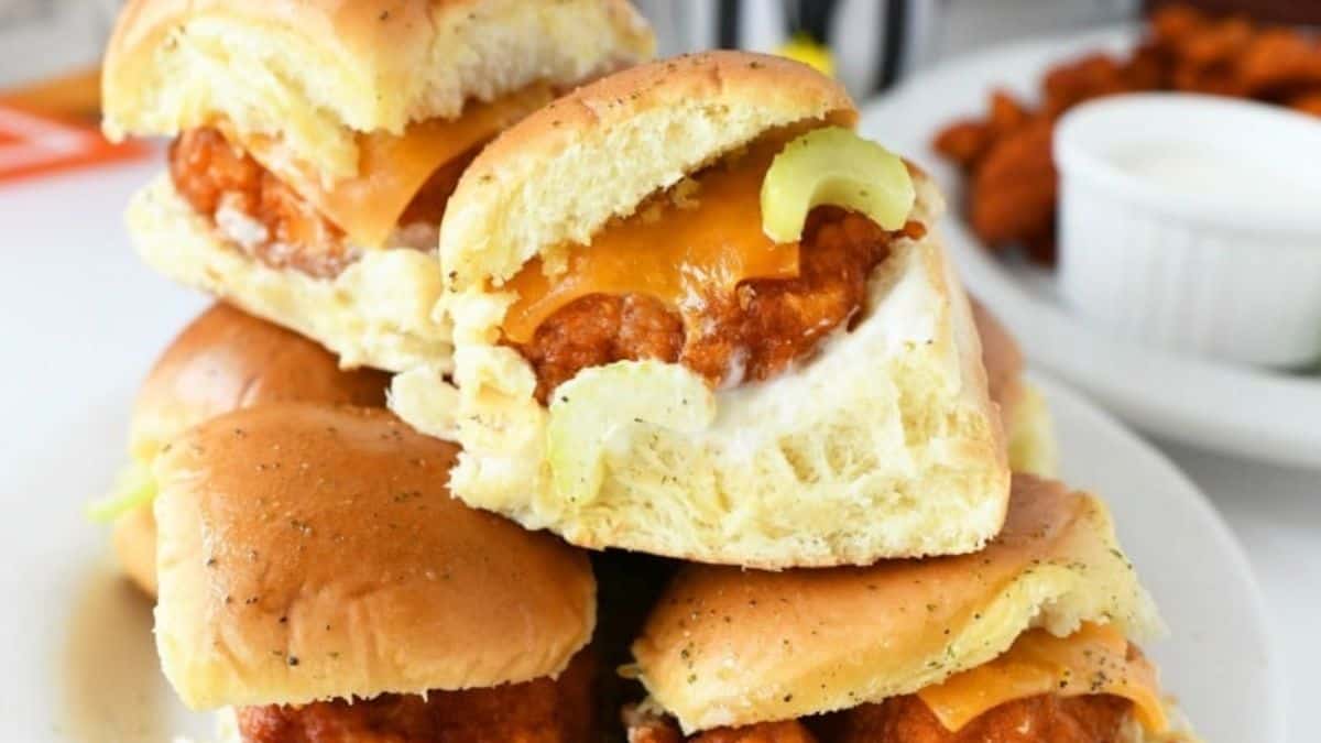 Buffalo chicken sliders with spicy shredded chicken on soft mini buns.