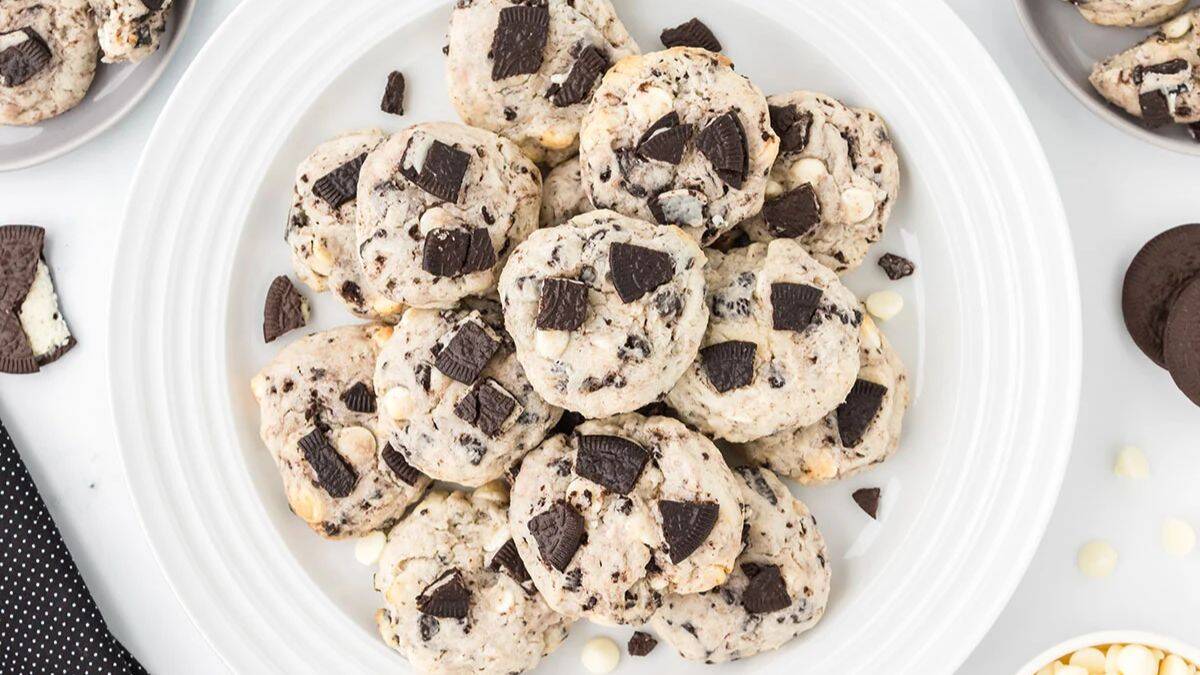 Top shot of a plate filled with a lot of cookies and cream cookies. 