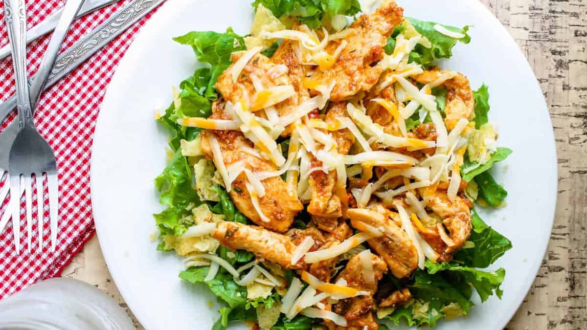 Top shot of a plate with a chicken tacos salad. 