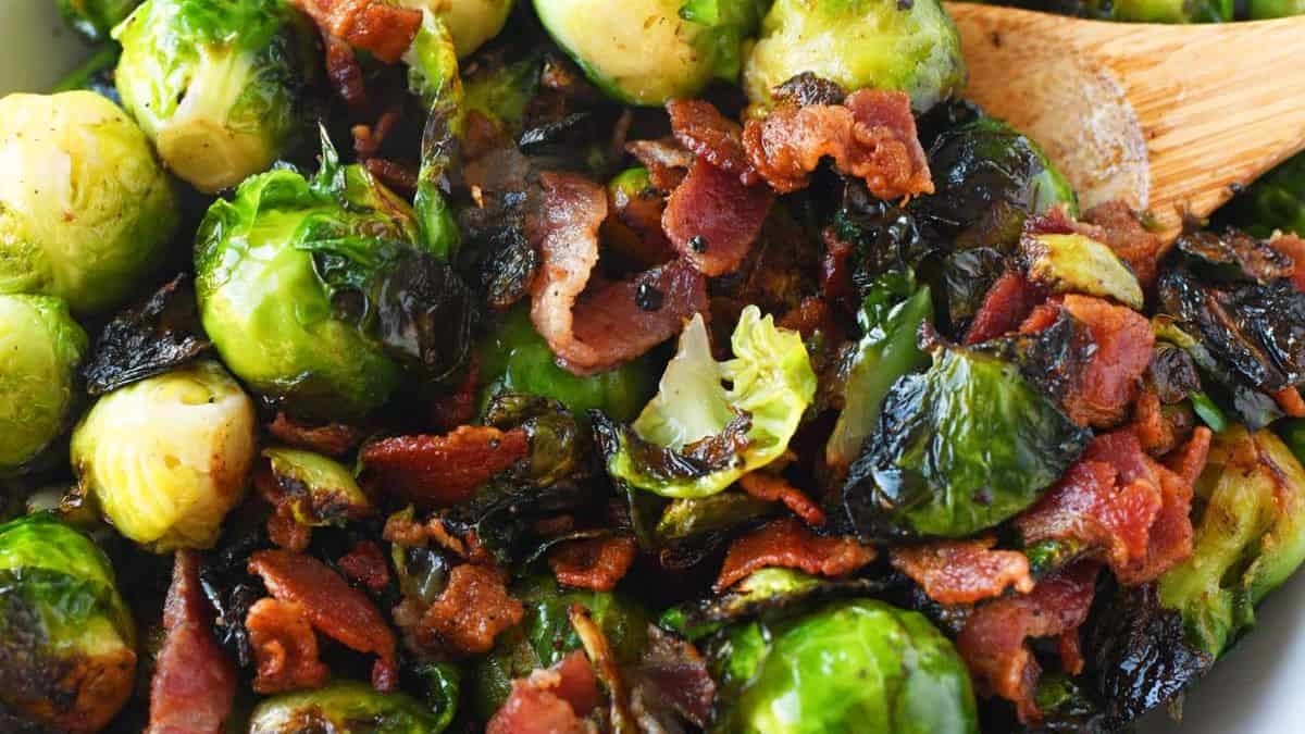 A close-up shot of sauteed brussels sprouts with bacon. 