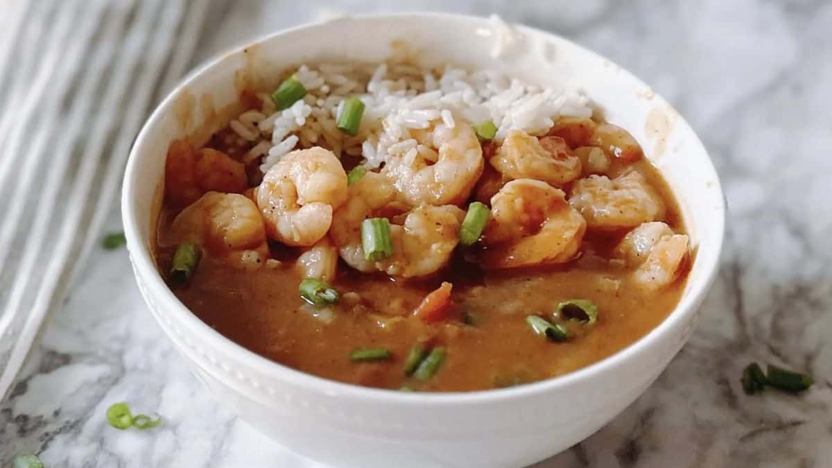 Shrimp étouffée with rich roux sauce served over rice.